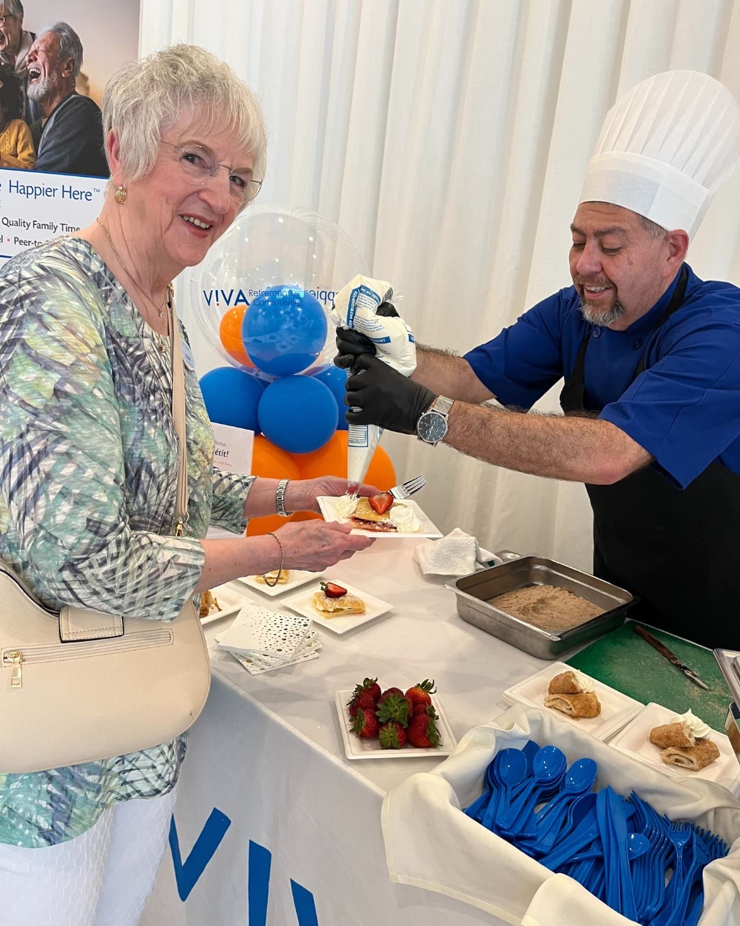 An elderly woman smiles.