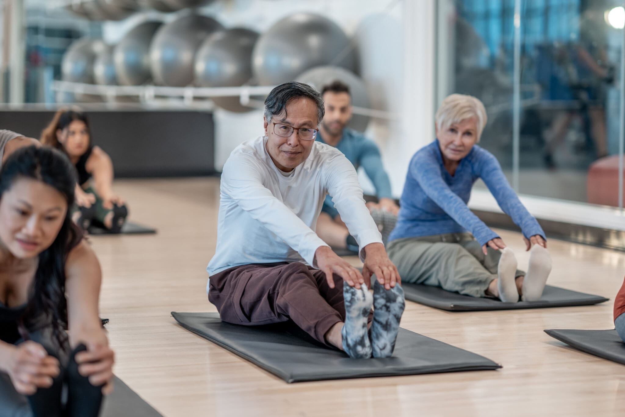 Group of older adults taking part in a fitness class at a Whitby retirement community.