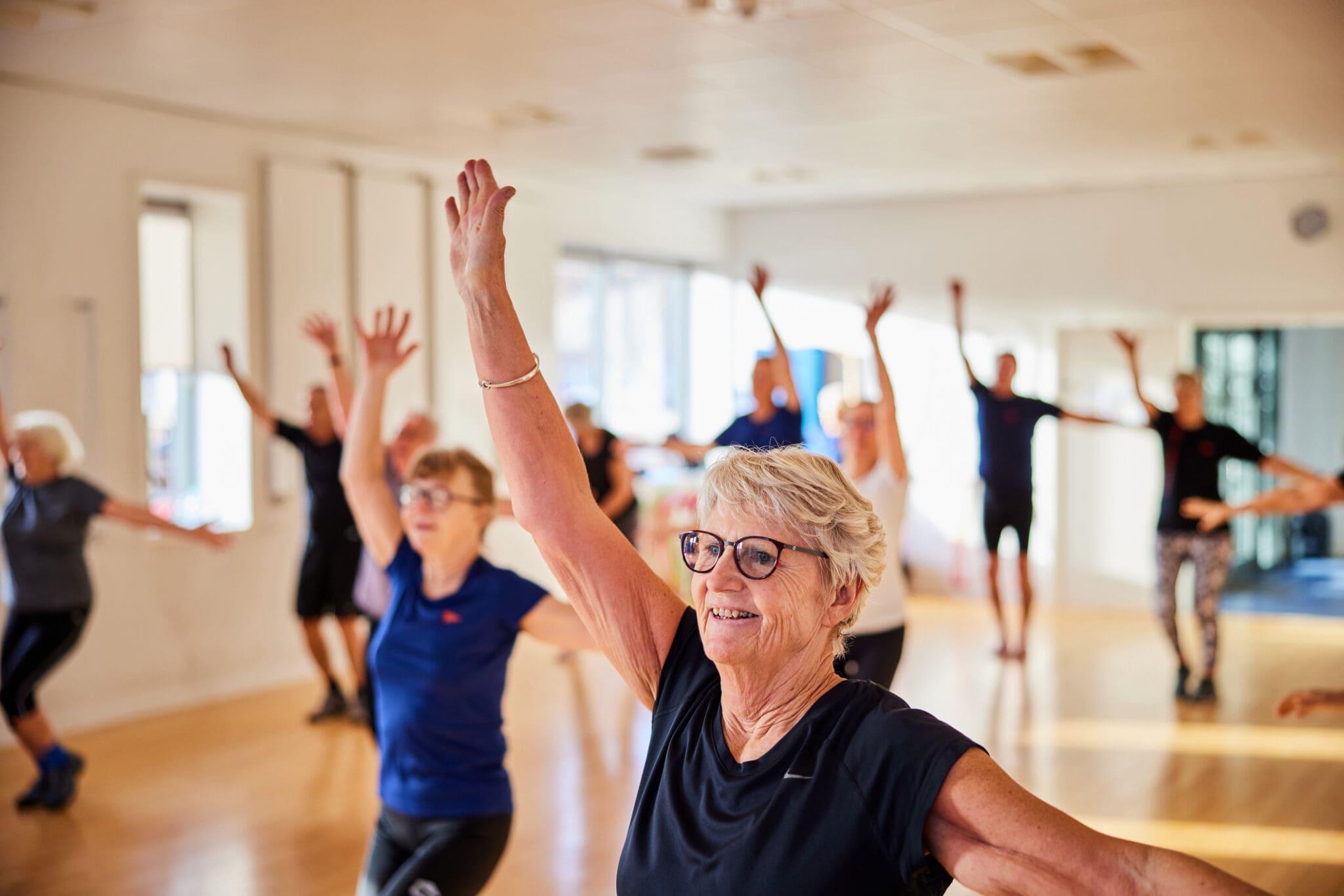 Active seniors in fitness class at an Oakville retirement residence.